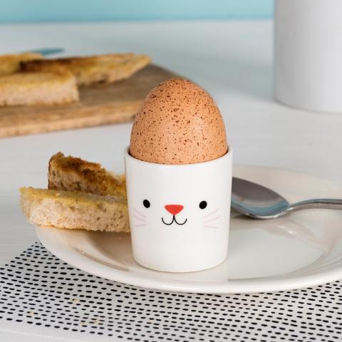 Cookie the Cat egg cup on a plate with some toast