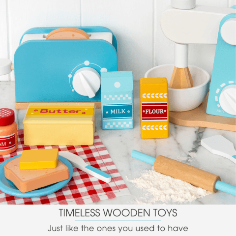 Wooden kitchen toys on a white table