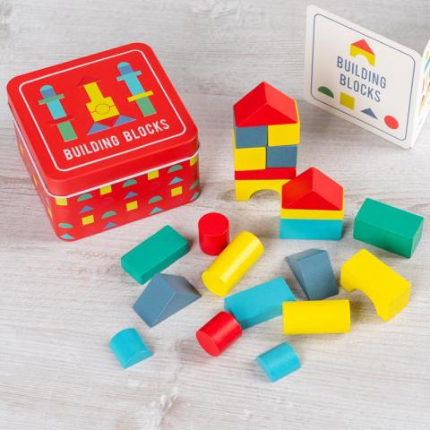 Wooden building blocks in a tin