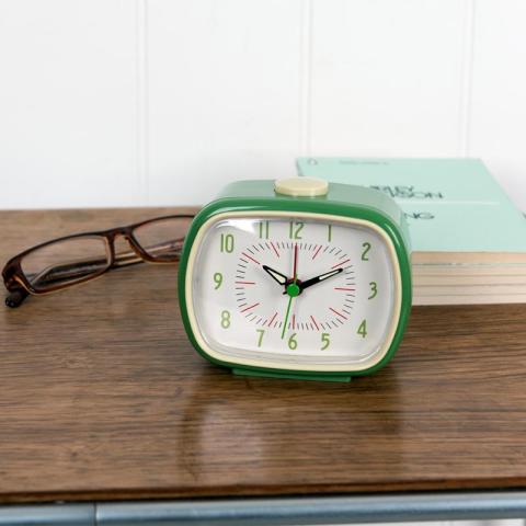 Alarm clock with book and glasses