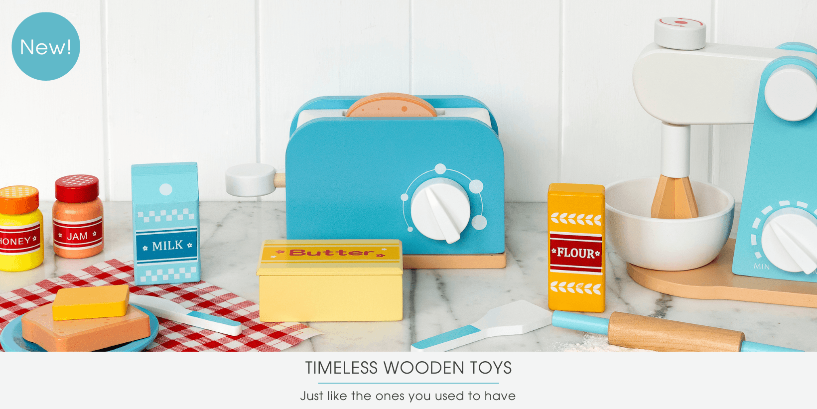 Wooden kitchen toys on a white table