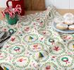 Cotton tea towel with a festive holiday design featuring Christmas trees, wreaths