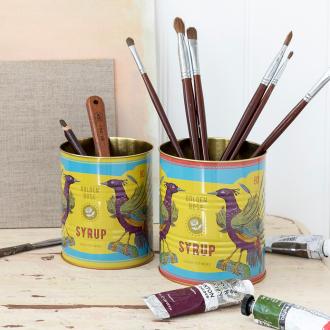 Golden Rose Syrup metal storage tins, one containing paintbrushes, one containing other art tools