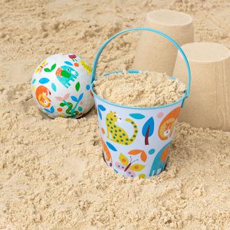 Wild Wonders tin bucket containing sand alongside play ball and sandcastles