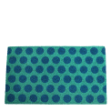Coir doormat with blue spots on turquoise coloured surface