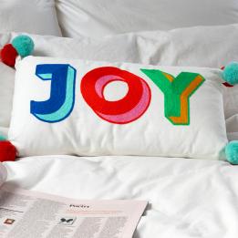 Embroidered cushion with pom poms - Joy