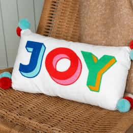 Embroidered cushion with pom poms - Joy