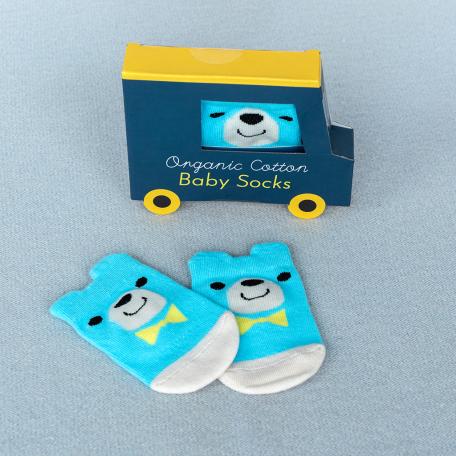 Pair of blue and white baby socks featuring bear face with yellow bow tie