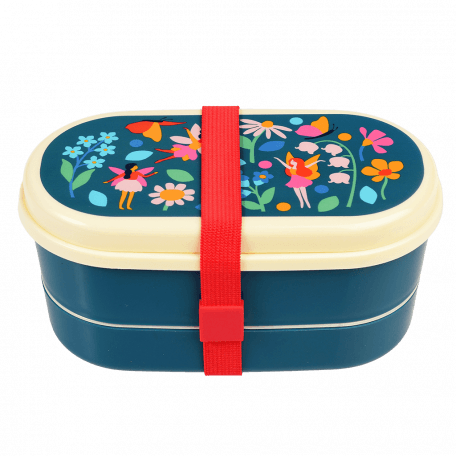 Dark blue kids bento box with cream lid and middle tray plus red elastic strap featuring print of fairies amongst flowers