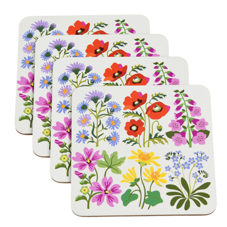 Four white wood and cork coasters featuring wild flower pattern