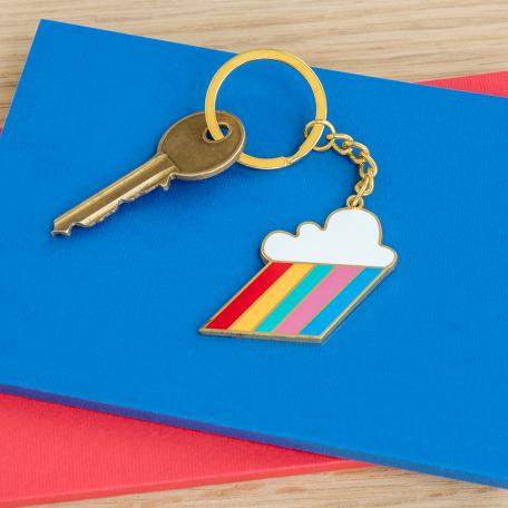 Cloud burst keyring on table with key attached