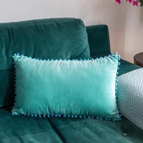 Aqua pom pom cushion