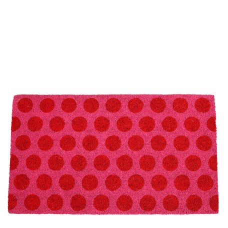 Coir doormat with red spots on pink surface