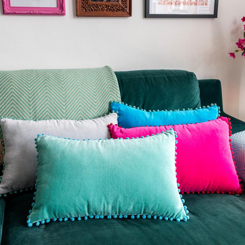 Green pom pom outlet cushion