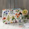 White oilcloth wash bag with wild flower pattern