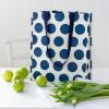 Recycled plastic shopping bag navy blue circles cream background