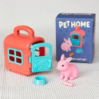pet carrier with pink rabbit and packaging box in the background